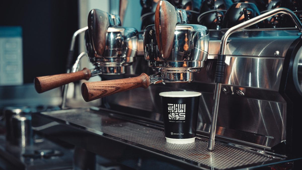 A Paper Cup on an Espresso Machine