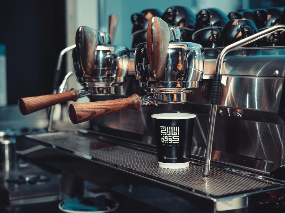 A Paper Cup on an Espresso Machine