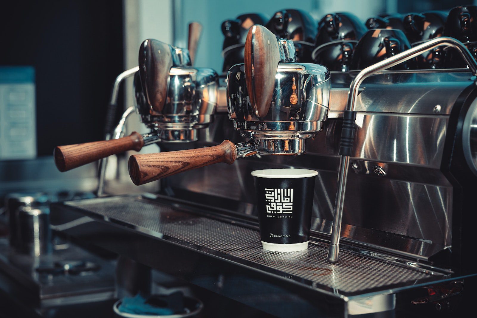 A Paper Cup on an Espresso Machine